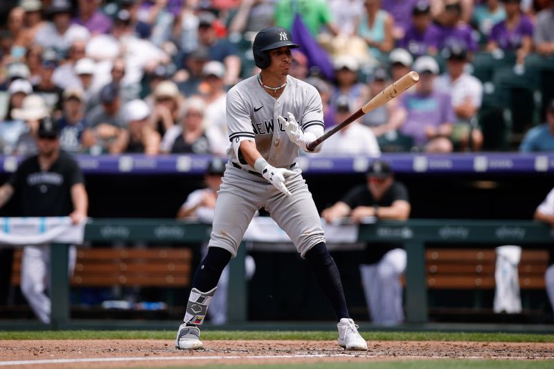 Jul 16, 2023; Denver, Colorado, USA; New York Yankees right fielder Oswaldo Cabrera (95) tosses his bat after being walked in the fifth inning against the Colorado Rockies at Coors Field. Mandatory Credit: Isaiah J. Downing-USA TODAY Sports