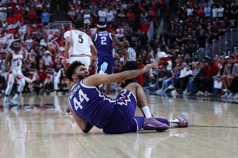 Feb 20, 2024; Lubbock, Texas, USA;  TCU Horned Frogs forward Essam Mostafa (44) reacts after hitting the floor in the second half during the game against the Texas Tech Red Raiders at United Supermarkets Arena. Mandatory Credit: Michael C. Johnson-USA TODAY Sports