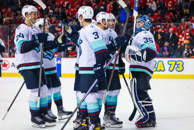 Nov 1, 2022; Calgary, Alberta, CAN; Seattle Kraken goaltender Joey Daccord (35) celebrate win with teammates against the Calgary Flames at Scotiabank Saddledome. Mandatory Credit: Sergei Belski-USA TODAY Sports