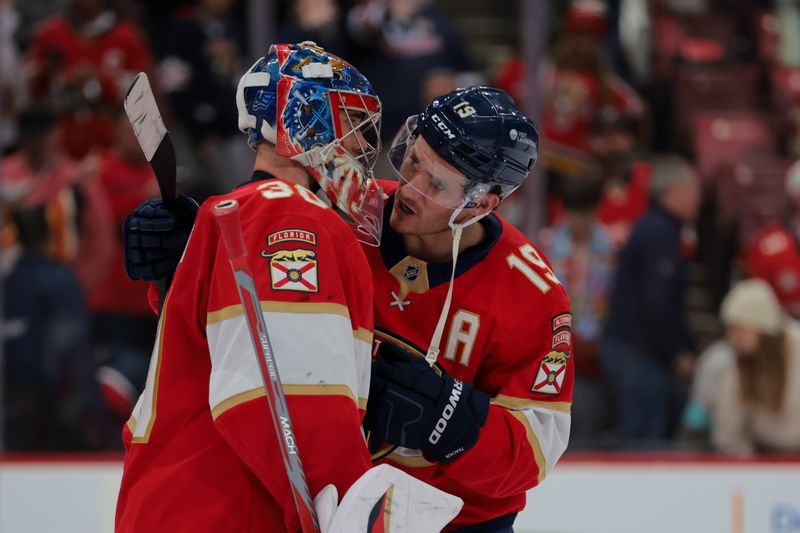 Nov 30, 2024; Sunrise, Florida, USA; Florida Panthers goaltender Spencer Knight (30) celebrates with left wing Matthew Tkachuk (19) after the game against the Carolina Hurricanes at Amerant Bank Arena. Mandatory Credit: Sam Navarro-Imagn Images