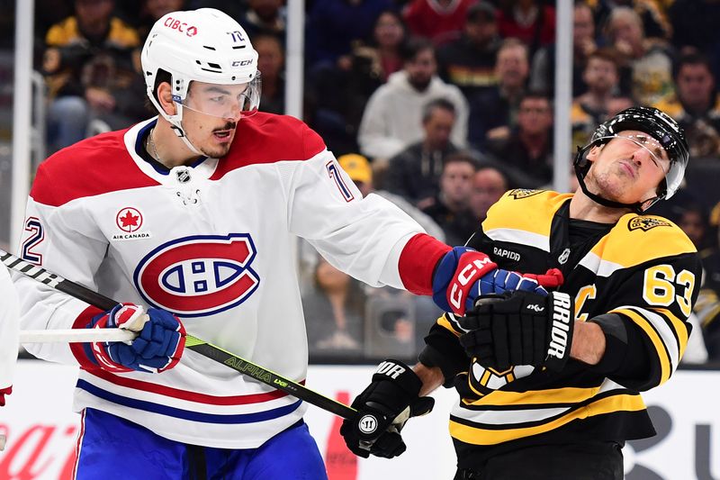 Oct 10, 2024; Boston, Massachusetts, USA;  Montreal Canadiens defenseman Arber Xhekaj (72) punches Boston Bruins left wing Brad Marchand (63) during the third period at TD Garden. Mandatory Credit: Bob DeChiara-Imagn Images