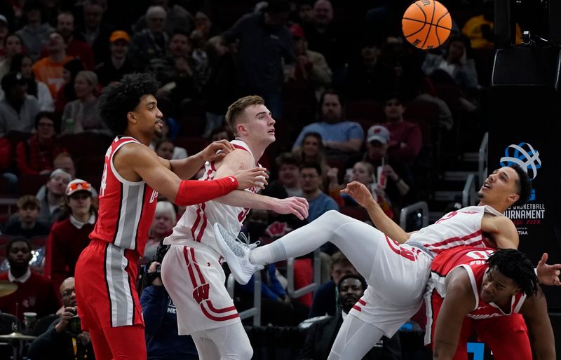 Mar 8, 2023; Chicago, IL, USA; Wisconsin Badgers guard Jordan Davis (2) and Ohio State Buckeyes forward Brice Sensabaugh (10) go for the ball during the second half at United Center. Mandatory Credit: David Banks-USA TODAY Sports