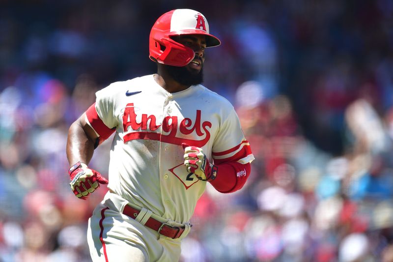 Aug 6, 2023; Anaheim, California, USA; Los Angeles Angels shortstop Luis Rengifo (2) reaches first on a single against the Seattle Mariners during the third inning at Angel Stadium. Mandatory Credit: Gary A. Vasquez-USA TODAY Sports