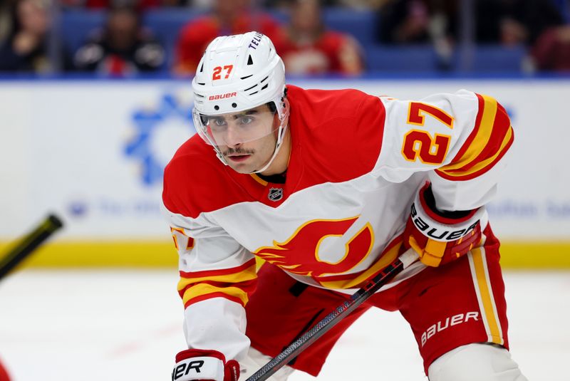 Nov 9, 2024; Buffalo, New York, USA;  Calgary Flames right wing Matt Coronato (27) waits for the face-off during the first period against the Buffalo Sabres at KeyBank Center. Mandatory Credit: Timothy T. Ludwig-Imagn Images