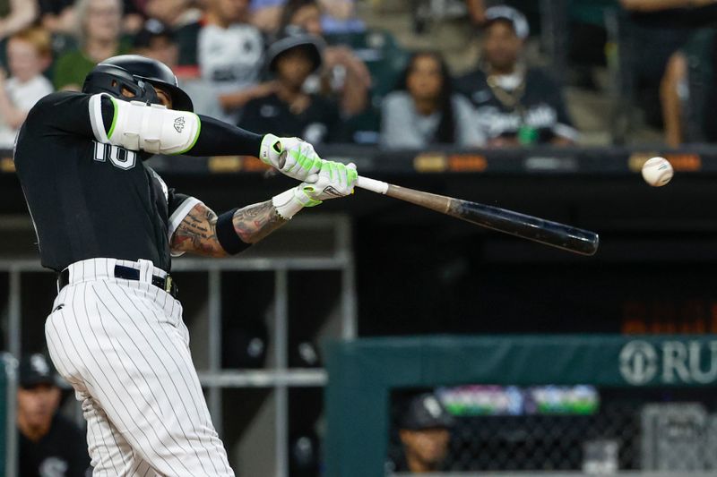 Sep 2, 2023; Chicago, Illinois, USA; Chicago White Sox third baseman Yoan Moncada (10) singles against the Detroit Tigers during the sixth inning at Guaranteed Rate Field. Mandatory Credit: Kamil Krzaczynski-USA TODAY Sports