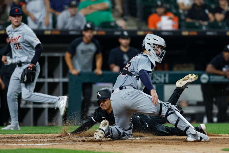 Aug 26, 2024; Chicago, Illinois, USA; Chicago White Sox second baseman Nicky Lopez (8) scores against the Detroit Tigers during the third inning at Guaranteed Rate Field. Mandatory Credit: Kamil Krzaczynski-USA TODAY Sports