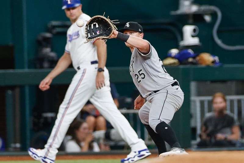 Aug 2, 2023; Arlington, Texas, USA; Chicago White Sox first baseman Andrew Vaughn (25) stretches for a catch during the eighth inning against the Texas Rangers at Globe Life Field. Mandatory Credit: Andrew Dieb-USA TODAY Sports