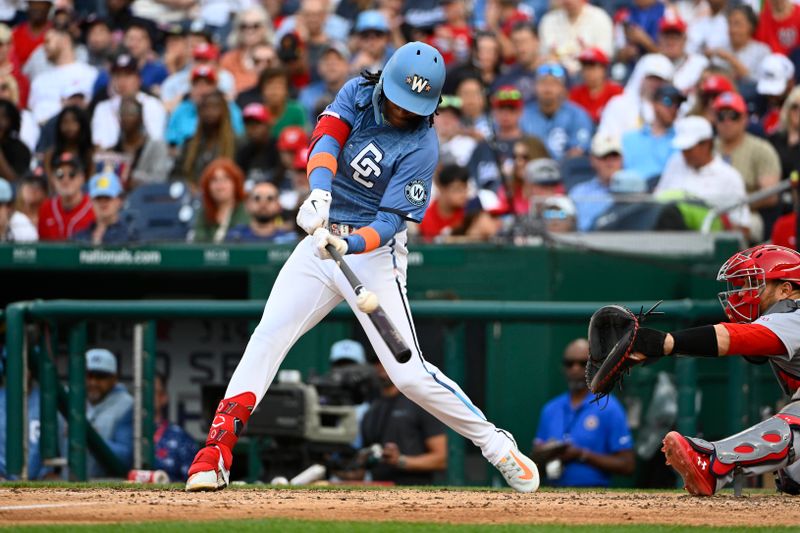 May 10, 2025; Washington, District of Columbia, USA; Washington Nationals shortstop CJ Abrams (5) doubles against the St. Louis Cardinals during the eighth inning at Nationals Park. Mandatory Credit: Brad Mills-Imagn Images