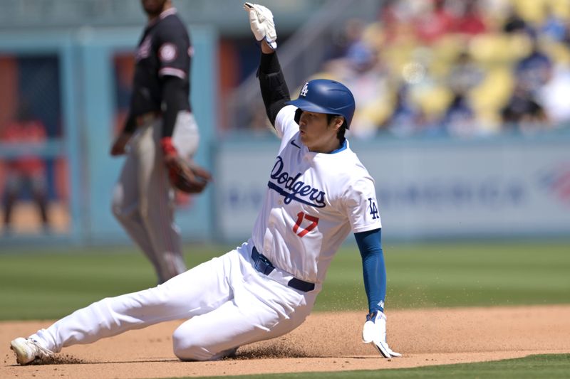 Apr 17, 2024; Los Angeles, California, USA; Los Angeles Dodgers designated hitter player Shohei Ohtani (17) steals second in the eighth inning against the Washington Nationals at Dodger Stadium. Mandatory Credit: Jayne Kamin-Oncea-USA TODAY Sports