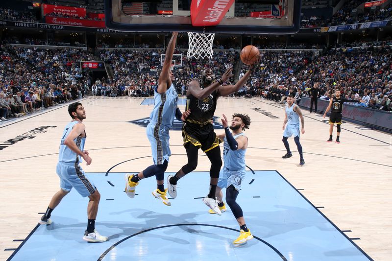 MEMPHIS, TN - MARCH 18: Draymond Green #23 of the Golden State Warriors drives to the basket during the game against the Memphis Grizzlies on March 18, 2023 at FedExForum in Memphis, Tennessee. NOTE TO USER: User expressly acknowledges and agrees that, by downloading and or using this photograph, User is consenting to the terms and conditions of the Getty Images License Agreement. Mandatory Copyright Notice: Copyright 2023 NBAE (Photo by Joe Murphy/NBAE via Getty Images)