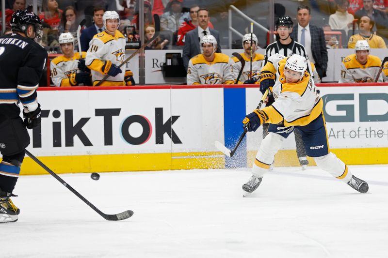 Nov 6, 2024; Washington, District of Columbia, USA; Nashville Predators defenseman Jeremy Lauzon (3) shoots the puck as Washington Capitals left wing Alex Ovechkin (8) defends in the third period at Capital One Arena. Mandatory Credit: Geoff Burke-Imagn Images