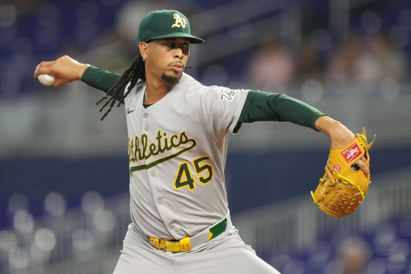 May 3, 2025; Miami, Florida, USA;  Oakland Athletics pitcher Osvaldo Bido (45) pitches in the first inning against the Miami Marlins at loanDepot Park. Mandatory Credit: Jim Rassol-Imagn Images