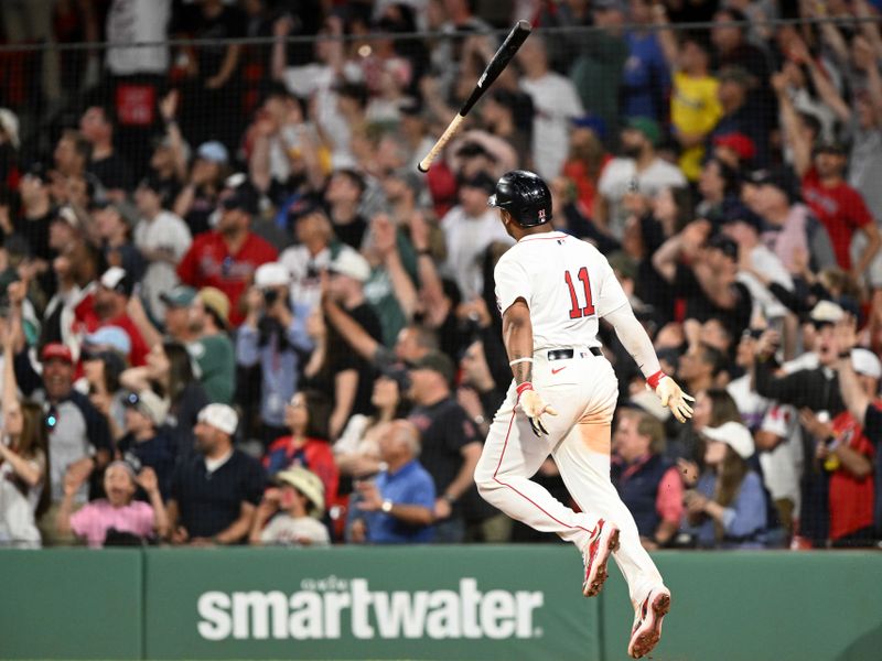 May 17, 2025; Boston, Massachusetts, USA; Boston Red Sox designated hitter Rafael Devers (11) hits a walk off home run against the Atlanta Braves during the ninth inning at Fenway Park. Mandatory Credit: Brian Fluharty-Imagn Images