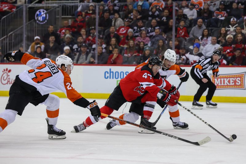 Jan 18, 2025; Newark, New Jersey, USA; New Jersey Devils center Paul Cotter (47) and Philadelphia Flyers defenseman Jamie Drysdale (9) battle for the puck during the second period at Prudential Center. Mandatory Credit: Ed Mulholland-Imagn Images