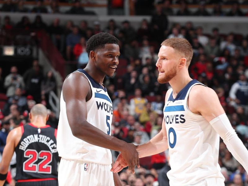 CHICAGO, IL - NOVEMBER 7: Anthony Edwards #5 and Donte DiVincenzo #0 of the Minnesota Timberwolves high five during the game against the Chicago Bulls on November 7, 2024 at United Center in Chicago, Illinois. NOTE TO USER: User expressly acknowledges and agrees that, by downloading and or using this photograph, User is consenting to the terms and conditions of the Getty Images License Agreement. Mandatory Copyright Notice: Copyright 2024 NBAE (Photo by Jeff Haynes/NBAE via Getty Images)