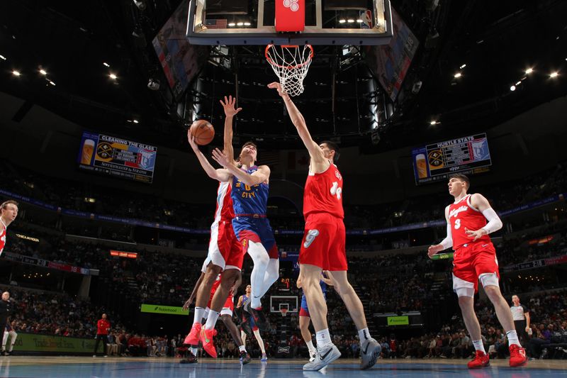 MEMPHIS, TN - NOVEMBER 17: Christian Braun #0 of the Denver Nuggets shoots the ball during the game against the Memphis Grizzlies on November 17, 2024 at FedExForum in Memphis, Tennessee. NOTE TO USER: User expressly acknowledges and agrees that, by downloading and or using this photograph, User is consenting to the terms and conditions of the Getty Images License Agreement. Mandatory Copyright Notice: Copyright 2024 NBAE (Photo by Joe Murphy/NBAE via Getty Images)