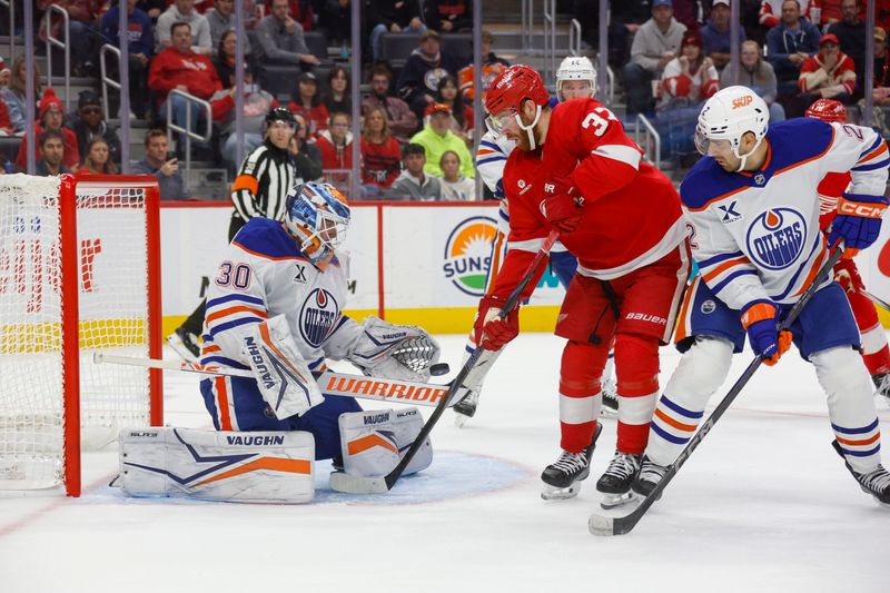 Oct 27, 2024; Detroit, Michigan, USA; Detroit Red Wings left wing J.T. Compher (37) takes a shot on goal against Edmonton Oilers goaltender Calvin Pickard (30) during the second period at Little Caesars Arena. Mandatory Credit: Brian Bradshaw Sevald-Imagn Images