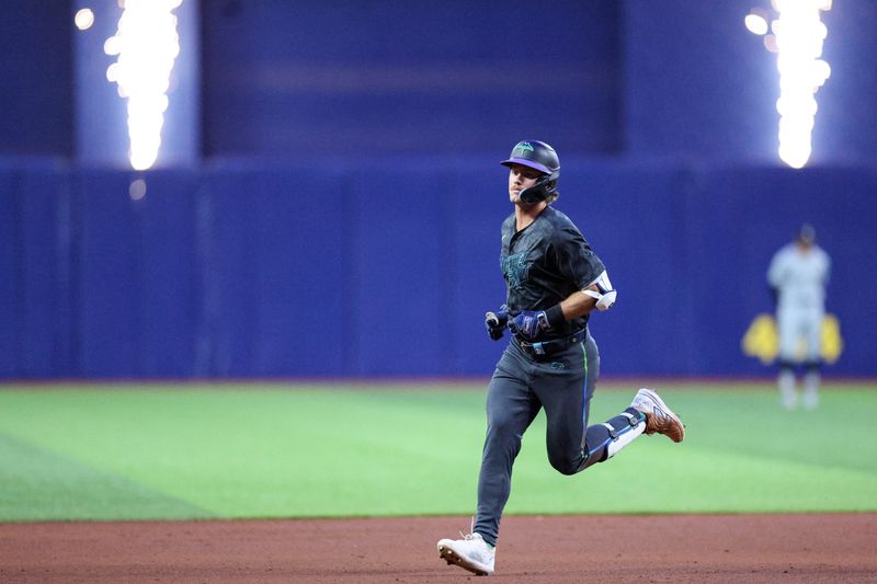 May 6, 2024; St. Petersburg, Florida, USA;  Tampa Bay Rays outfielder Jonny DeLuca (21) runs the bases after hitting a two run home run against the Chicago White Sox in the fifth inning at Tropicana Field. Mandatory Credit: Nathan Ray Seebeck-USA TODAY Sports