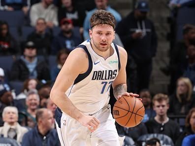 MEMPHIS, TN - DECEMBER 11:  Luka Doncic #77 of the Dallas Mavericks handles the ball during the game against the Memphis Grizzlies on December 11, 2023 at FedExForum in Memphis, Tennessee. NOTE TO USER: User expressly acknowledges and agrees that, by downloading and or using this photograph, User is consenting to the terms and conditions of the Getty Images License Agreement. Mandatory Copyright Notice: Copyright 2023 NBAE (Photo by Joe Murphy/NBAE via Getty Images)