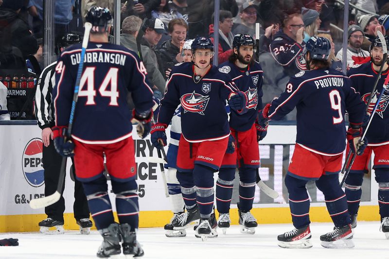 Jan 24, 2026; Columbus, Ohio, USA;  Columbus Blue Jackets left wing Mason Marchment (17) celebrates his third goal of the game with teammates during the third period against the Tampa Bay Lightning at Nationwide Arena. Mandatory Credit: Joseph Maiorana-Imagn Images
