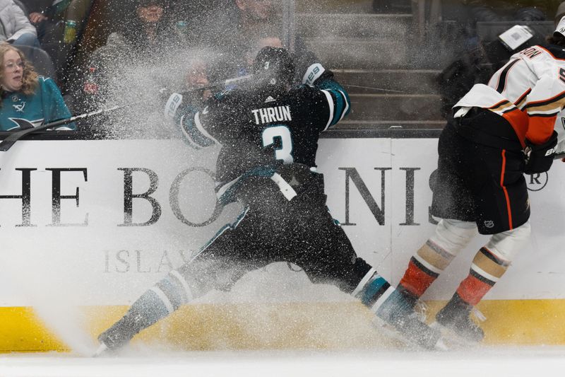 Feb 29, 2024; San Jose, California, USA; San Jose Sharks defenseman Henry Thrun (3) collides into the wall during the first period against the Anaheim Ducks at SAP Center at San Jose. Mandatory Credit: Stan Szeto-USA TODAY Sports