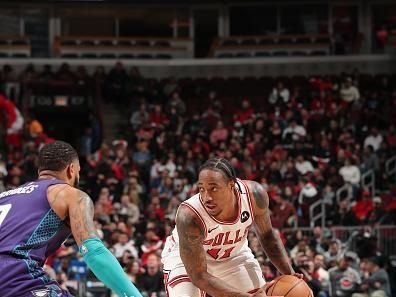 CHICAGO, IL - DECEMBER 6: DeMar DeRozan #11 of the Chicago Bulls handles the ball during the game against the Charlotte Hornets on December 6, 2023 at the United Center in Chicago, Illinois. NOTE TO USER: User expressly acknowledges and agrees that, by downloading and or using this Photograph, user is consenting to the terms and conditions of the Getty Images License Agreement. Mandatory Copyright Notice: Copyright 2023 NBAE (Photo by Gary Dineen/NBAE via Getty Images).