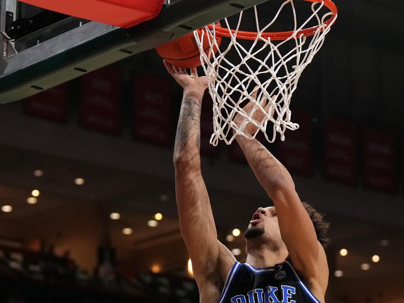 Feb 6, 2023; Coral Gables, Florida, USA; Duke Blue Devils center Dereck Lively II (1) puts up a shot against the Miami Hurricanes during the first half at Watsco Center. Mandatory Credit: Jasen Vinlove-USA TODAY Sports