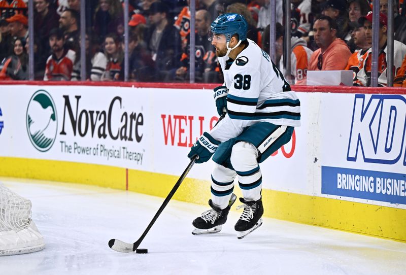 Mar 12, 2024; Philadelphia, Pennsylvania, USA; San Jose Sharks defenseman Mario Ferraro (38) controls the puck against the Philadelphia Flyers in the first period at Wells Fargo Center. Mandatory Credit: Kyle Ross-USA TODAY Sports