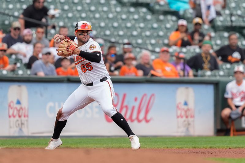 Aug 24, 2025; Baltimore, Maryland, USA; Baltimore Orioles third baseman Vimael Machin (65) throws to second base to record an out after fielding a ground ball hit by Houston Astros center fielder Chas McCormick (20) (not pictured) during the fourth inning at Oriole Park at Camden Yards. Mandatory Credit: Gregory Fisher-Imagn Images