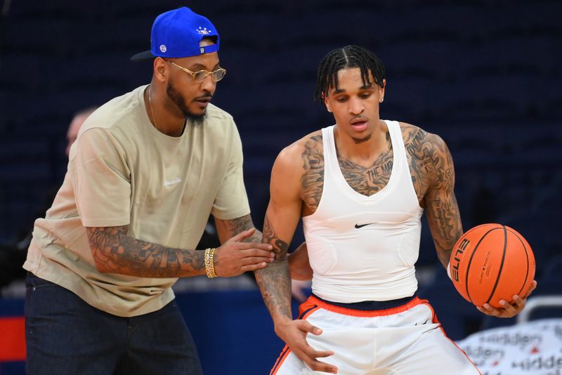 Jan 21, 2026; Syracuse, New York, USA; Hall of Fame member Carmelo Anthony (left) works with Syracuse Orange forward Sadiq White Jr. (left) prior to the game against the Virginia Tech Hokies at the JMA Wireless Dome. Mandatory Credit: Rich Barnes-Imagn Images