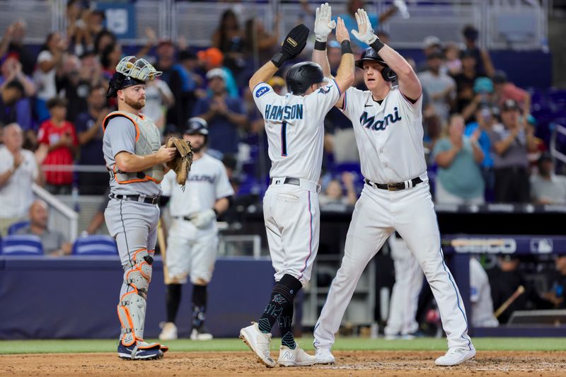 Jul 30, 2023; Miami, Florida, USA; Miami Marlins designated hitter Garrett Cooper (26) celebrates with center fielder Garrett Hampson (1) after hitting a two-run home run against the Detroit Tigers during the seventh inning at loanDepot Park. Mandatory Credit: Sam Navarro-USA TODAY Sports