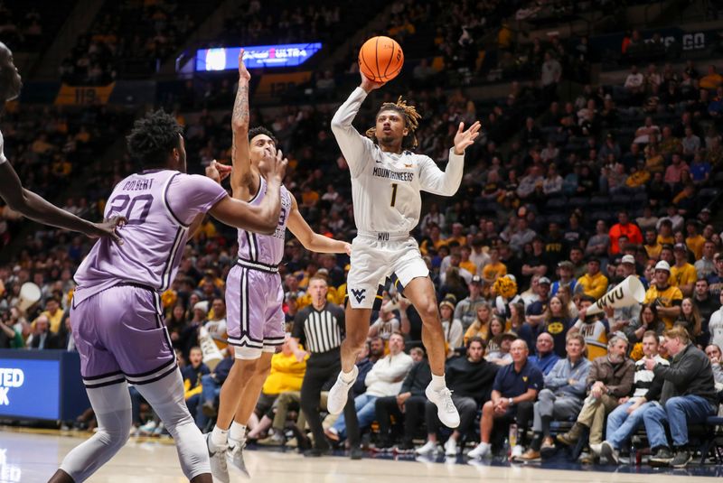 Jan 9, 2024; Morgantown, West Virginia, USA; West Virginia Mountaineers guard Noah Farrakhan (1) shoots during the second half against the Kansas State Wildcats at WVU Coliseum. Mandatory Credit: Ben Queen-USA TODAY Sports