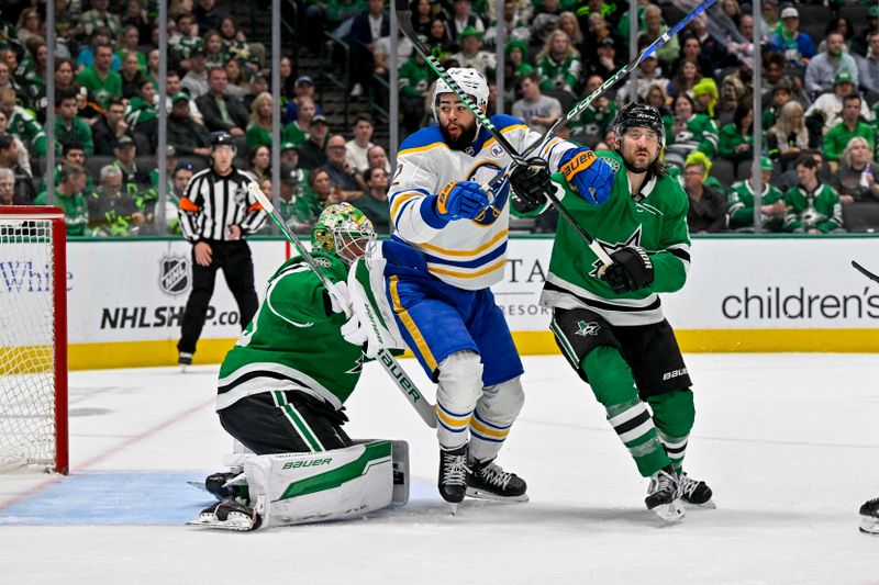 Apr 9, 2024; Dallas, Texas, USA; Dallas Stars goaltender Jake Oettinger (29) and defenseman Chris Tanev (3) and Buffalo Sabres left wing Jordan Greenway (12) look for the puck in the Dallas zone during the third period at the American Airlines Center. Mandatory Credit: Jerome Miron-USA TODAY Sports