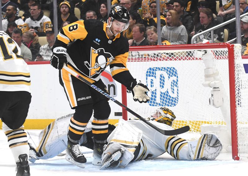 Apr 13, 2024; Pittsburgh, Pennsylvania, USA; Pittsburgh Penguins left wing Michael Bunting (8) reacts after colliding with Boston Bruins goalie Linus Ullmark (35) during the first period at PPG Paints Arena. Mandatory Credit: Philip G. Pavely-USA TODAY Sports