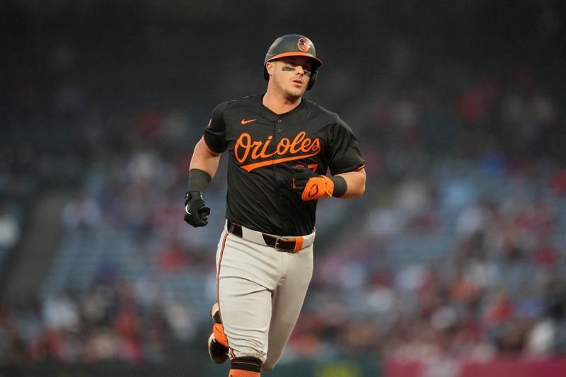 Apr 22, 2024; Anaheim, California, USA; Baltimore Orioles catcher James McCann (27) runs the bases after a solo home run in the second inning against the Los Angeles Angels at Angel Stadium. Mandatory Credit: Kirby Lee-USA TODAY Sports