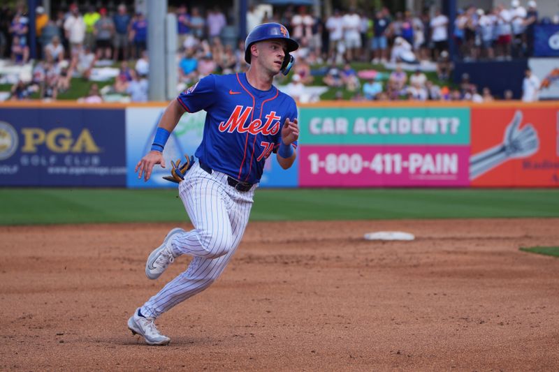 Mar 5, 2024; Port St. Lucie, Florida, USA;  New York Mets second baseman Zack Short (74) advances to third base in the third inning following a double by Brandon Nimmo (9) against the New York Yankees at Clover Park. Mandatory Credit: Jim Rassol-USA TODAY Sports