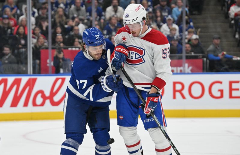 Sep 26, 2024; Toronto, Ontario, CAN;  Toronto Maple Leafs defenseman Timothy Liljegren (37) covers Montreal Canadiens forward Michael Pezzetta (55) in the third period at Scotiabank Arena. Mandatory Credit: Dan Hamilton-Imagn Images