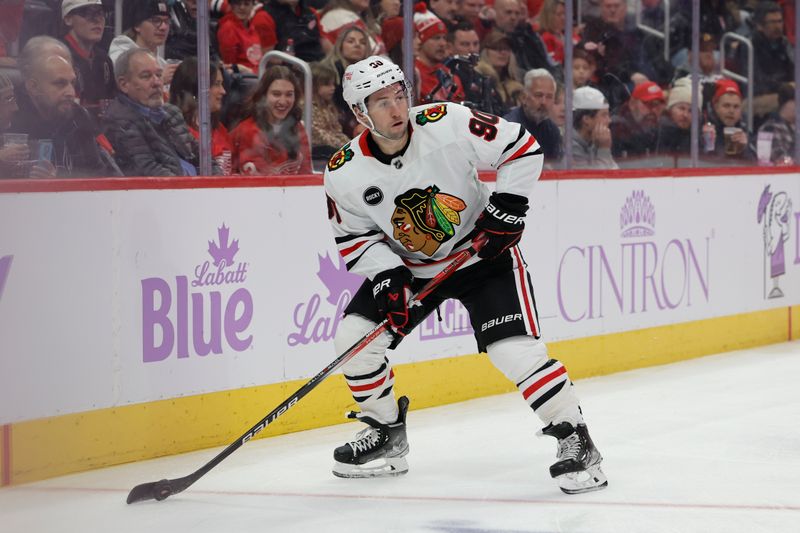 Nov 30, 2023; Detroit, Michigan, USA;  Chicago Blackhawks center Tyler Johnson (90) skates with the puck in the first period against the Detroit Red Wings at Little Caesars Arena. Mandatory Credit: Rick Osentoski-USA TODAY Sports