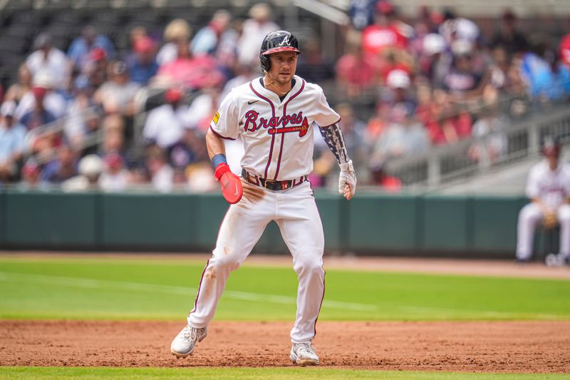 Jul 24, 2024; Cumberland, Georgia, USA; Atlanta Braves center fielder Jarred Kelenic (24) on base against the Cincinnati Reds during the second inning at Truist Park. Mandatory Credit: Dale Zanine-USA TODAY Sports