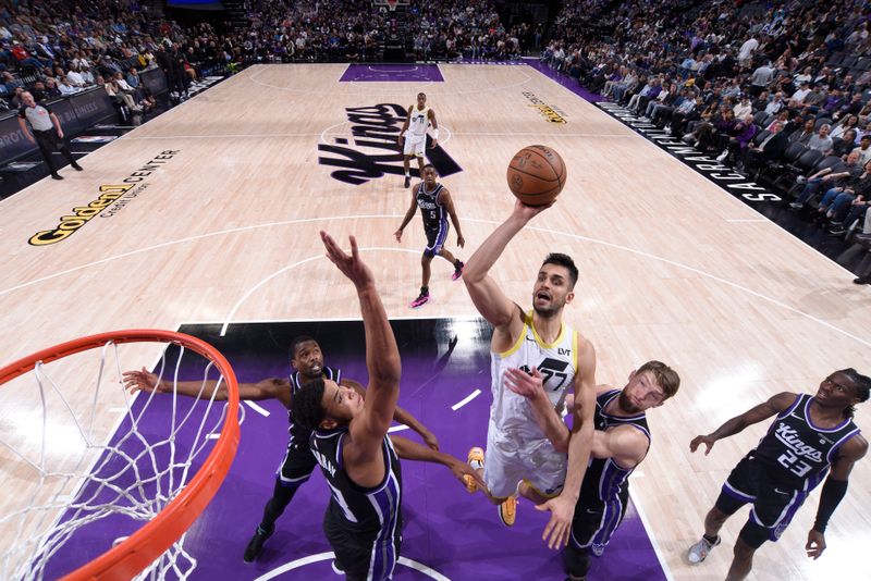 SACRAMENTO, CA - MARCH 31: Omer Yurtseven #77 of the Utah Jazz drives to the basket during the game against the Sacramento Kings on March 31, 2024 at Golden 1 Center in Sacramento, California. NOTE TO USER: User expressly acknowledges and agrees that, by downloading and or using this Photograph, user is consenting to the terms and conditions of the Getty Images License Agreement. Mandatory Copyright Notice: Copyright 2024 NBAE (Photo by Rocky Widner/NBAE via Getty Images)