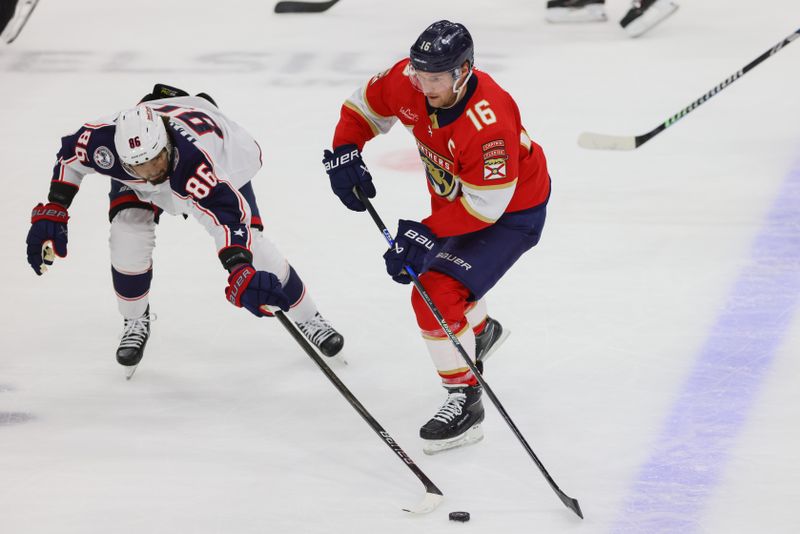 Apr 11, 2024; Sunrise, Florida, USA; Florida Panthers center Aleksander Barkov (16) moves the puck against Columbus Blue Jackets right wing Kirill Marchenko (86) during the first period at Amerant Bank Arena. Mandatory Credit: Sam Navarro-USA TODAY Sports