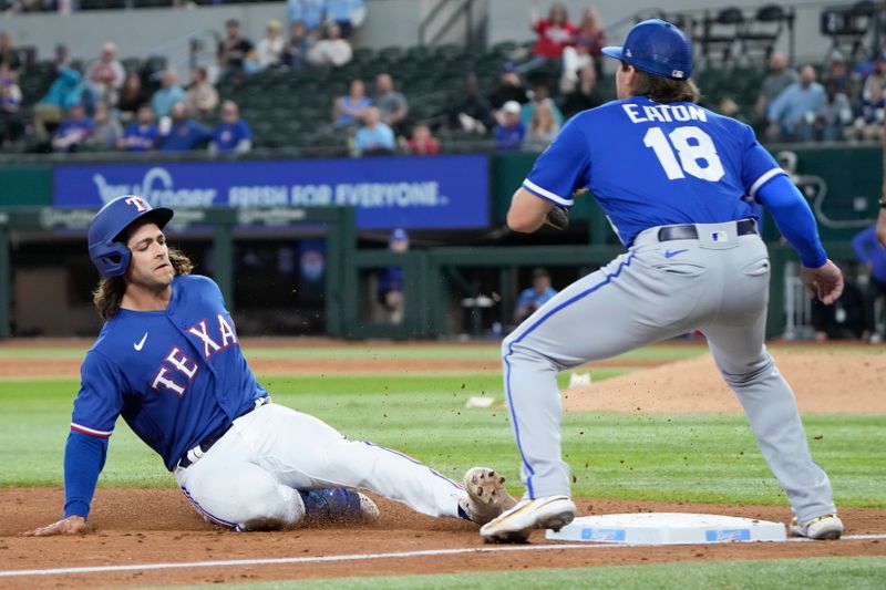 Mar 28, 2023; Arlington, Texas, USA; Texas Rangers third baseman Josh Smith (47) slides to third on his triple ahead of the throw to Kansas City Royals third baseball Nate Eaton (18) during the eighth inning of an exhibition game at Globe Life Field. Mandatory Credit: Jim Cowsert-USA TODAY Sports