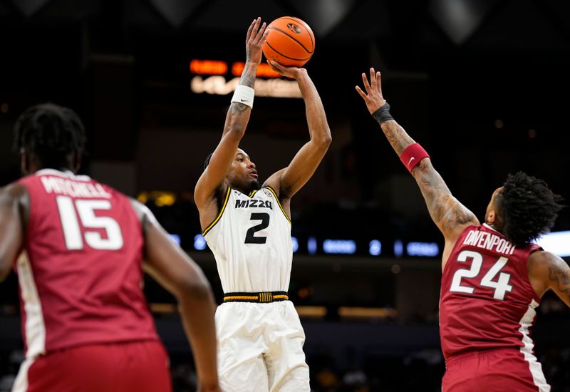 Jan 31, 2024; Columbia, Missouri, USA; Missouri Tigers guard Tamar Bates (2) shoots against Arkansas Razorbacks guard Jeremiah Davenport (24) during the first half at Mizzou Arena. Mandatory Credit: Jay Biggerstaff-USA TODAY Sports