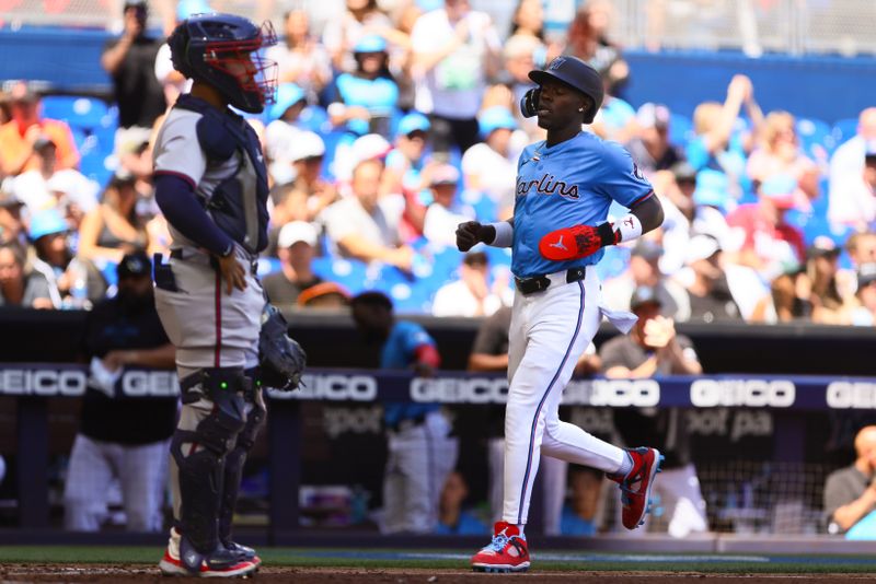 Apr 14, 2024; Miami, Florida, USA; Miami Marlins center fielder Jazz Chisholm Jr. (2) scores against the Atlanta Braves during the fourth inning at loanDepot Park. Mandatory Credit: Sam Navarro-USA TODAY Sports