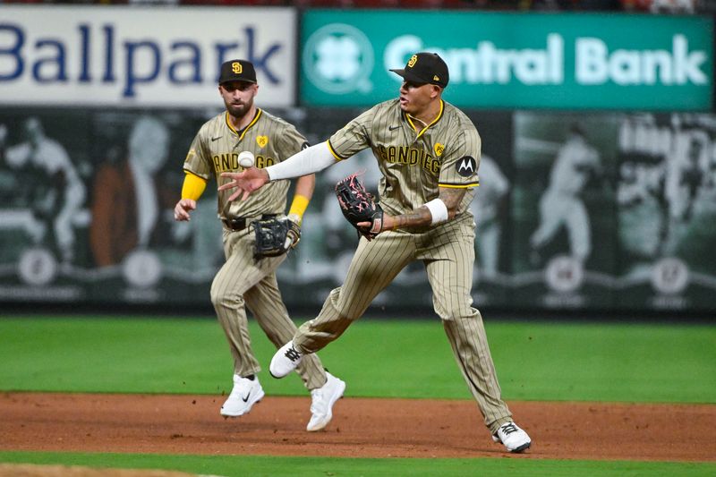 Aug 27, 2024; St. Louis, Missouri, USA;  San Diego Padres third baseman Manny Machado (13) fields a ground ball and throws out St. Louis Cardinals catcher Ivan Herrera (not pictured) during the fifth inning at Busch Stadium. Mandatory Credit: Jeff Curry-USA TODAY Sports