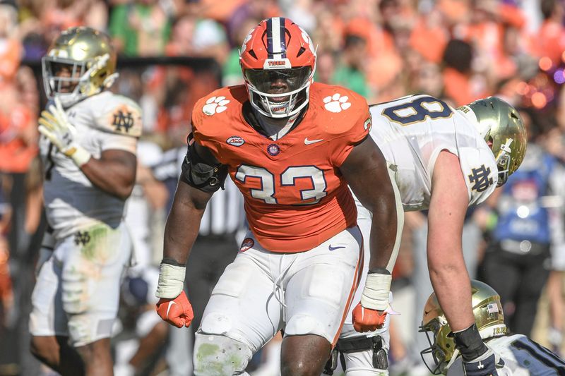 Nov 4, 2023; Clemson, South Carolina, USA;  Clemson Tigers defensive tackle Ruke Orhorhoro (33) celebrates after a tackle against the Notre Dame Fighting Irish during the fourth quarter at Memorial Stadium. Mandatory Credit: Ken Ruinard-USA TODAY Sports