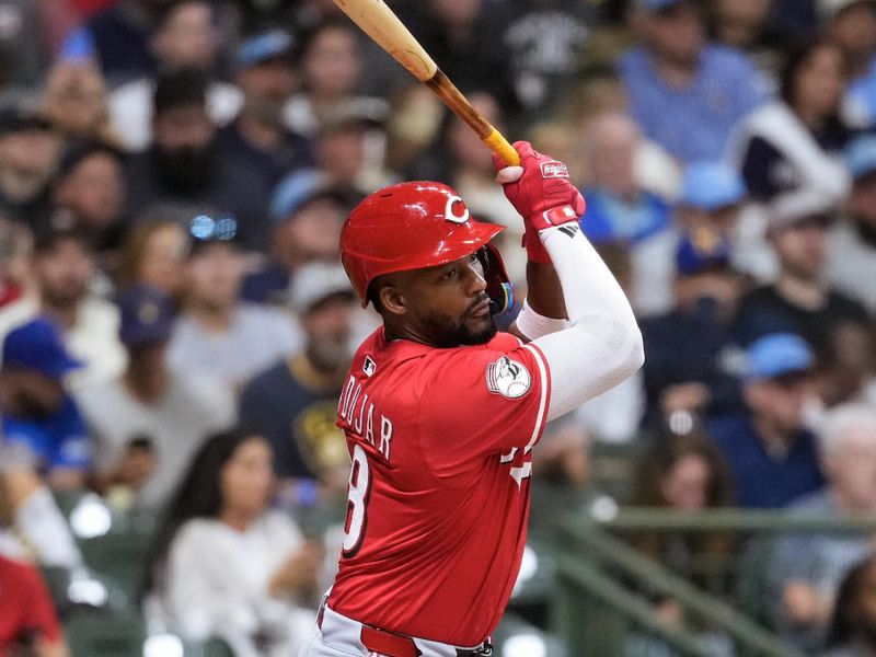 Sep 26, 2025; Milwaukee, Wisconsin, USA;  Cincinnati Reds left fielder Miguel Andujar (38) singles during the fourth inning against the Milwaukee Brewers at American Family Field. Mandatory Credit: Jeff Hanisch-Imagn Images