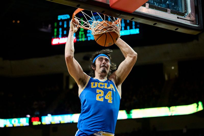 Feb 11, 2023; Eugene, Oregon, USA;  UCLA Bruins guard Jaime Jaquez Jr. (24) slam dunks the basketball during the second half against the Oregon Ducks at Matthew Knight Arena. Mandatory Credit: Troy Wayrynen-USA TODAY Sports