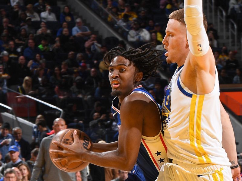 SAN FRANCISCO, CA - MARCH 24: Tyrese Maxey #0 of the Philadelphia 76ers handles the ball during the game against the Golden State Warriors on March 24, 2023 at Chase Center in San Francisco, California. NOTE TO USER: User expressly acknowledges and agrees that, by downloading and or using this photograph, user is consenting to the terms and conditions of Getty Images License Agreement. Mandatory Copyright Notice: Copyright 2023 NBAE (Photo by Noah Graham/NBAE via Getty Images)