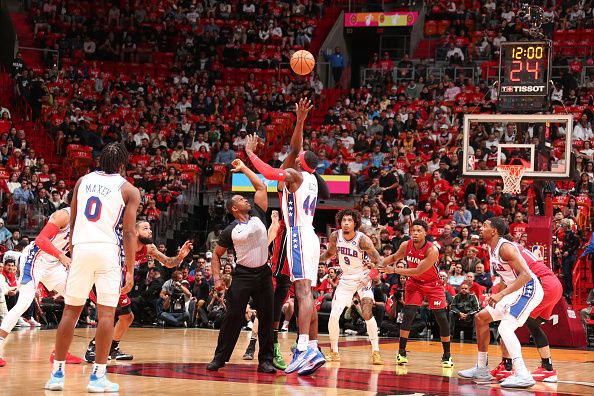 MIAMI, FL - DECEMBER 25:  Paul Reed #44 of the Philadelphia 76ers Bam Adebayo #13 of the Miami Heat during open tip-off on December 25, 2023 at Kaseya Center Arena in Miami, Florida. NOTE TO USER: User expressly acknowledges and agrees that, by downloading and or using this Photograph, user is consenting to the terms and conditions of the Getty Images License Agreement. Mandatory Copyright Notice: Copyright 2023 NBAE (Photo by Issac Baldizon/NBAE via Getty Images)